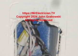 An existing wall switch with the correct wires needed for adding a new outlet.