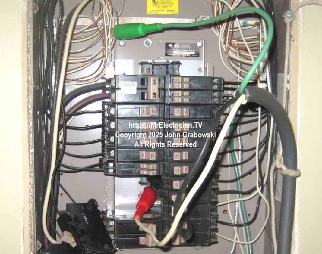 A Cutler-Hammer type CH residential electrical load center with spring clips being used to siphon off electrical power using a portable rubber cord