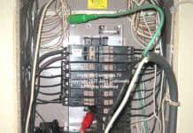 A Cutler-Hammer type CH residential electrical load center with spring clips being used to siphon off electrical power using a portable rubber cord